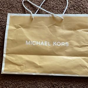 New Micheal Kors purse and white in color